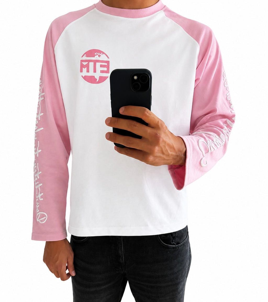 Pink and white long sleeve with writing