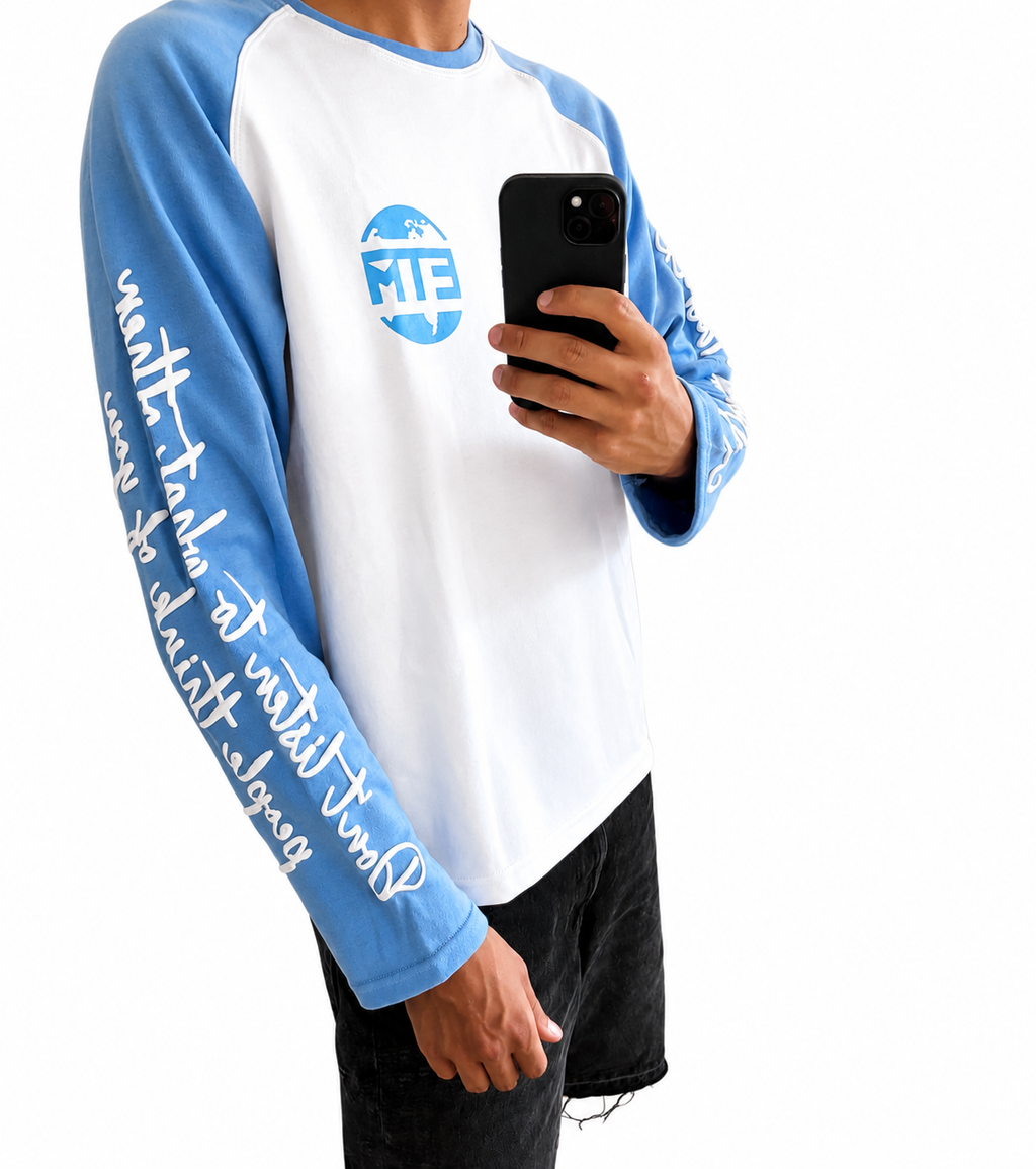 Baby blue and white long sleeve with writing