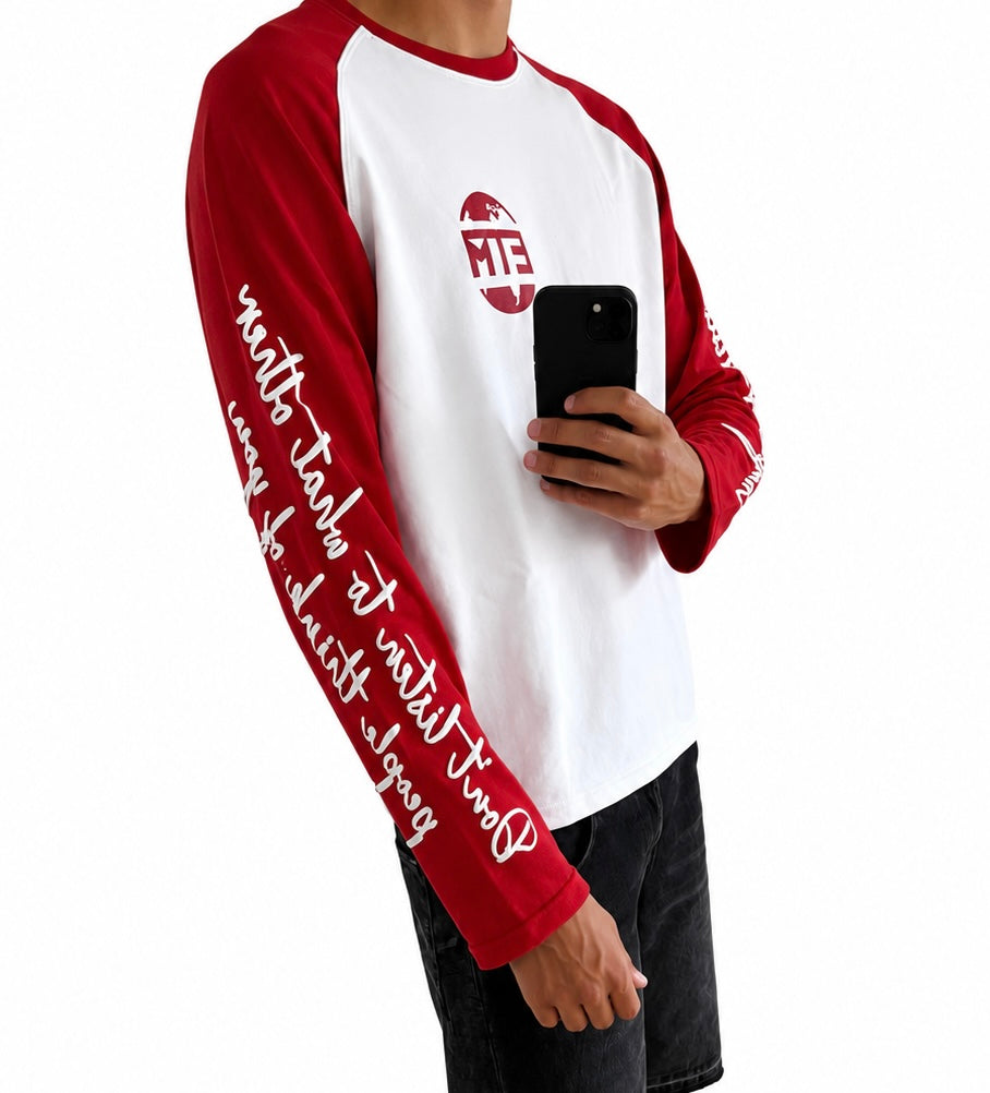 Red and white long sleeve with writing