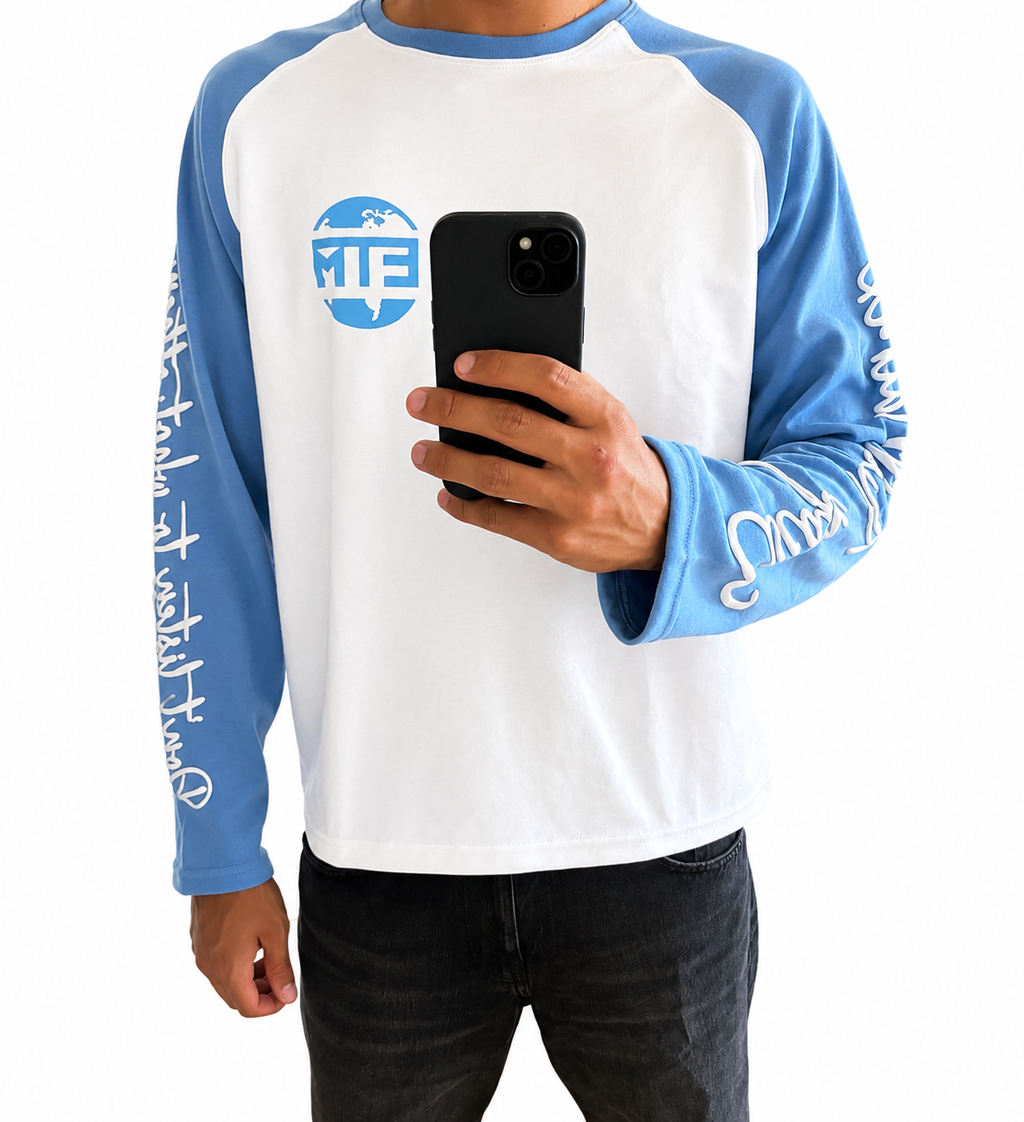 Baby blue and white long sleeve with writing